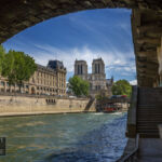 Under the bridges of Paris viewing Notre Dame