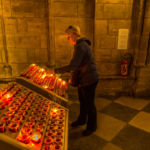 Lighting candles at Notre Dame